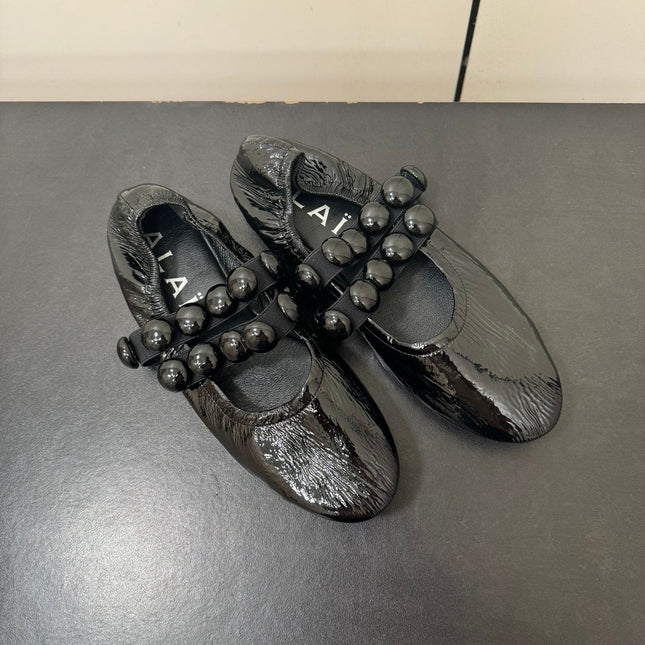 ALAIA SPHERE BALLET FLATS IN BLACK LAMBSKIN