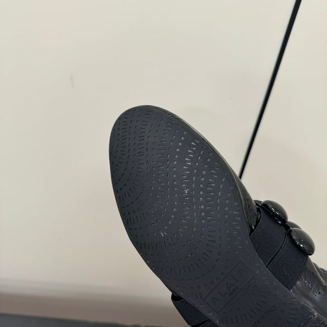 ALAIA SPHERE BALLET FLATS IN BLACK LAMBSKIN