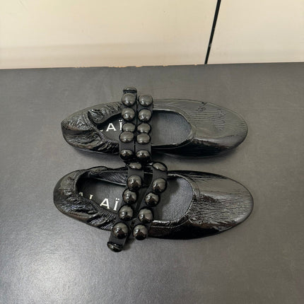 ALAIA SPHERE BALLET FLATS IN BLACK LAMBSKIN