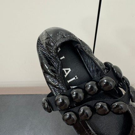 ALAIA SPHERE BALLET FLATS IN BLACK LAMBSKIN