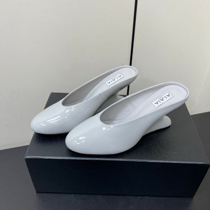 ALAIA WEDGE MULES 25S IN WHITE LAMBSKIN