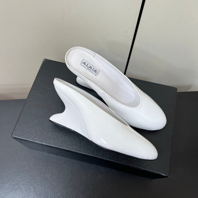 ALAIA WEDGE MULES 25S IN CREAM WHITE LAMBSKIN