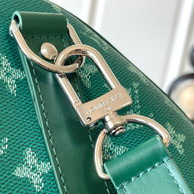 KEEPALL BANDOULIÈRE 50 IN GREEN MONOGRAM HERITAGE CANVAS