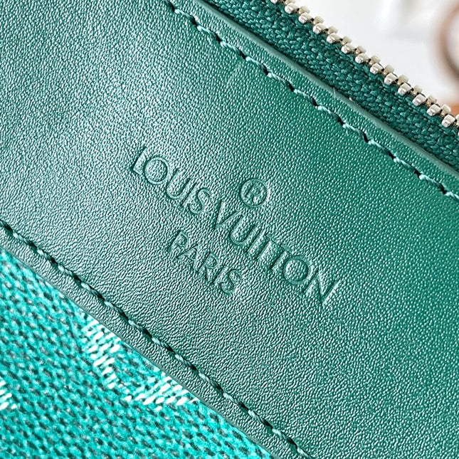 POCHETTE VOYAGE SOUPLE 32 IN GREEN MONOGRAM HERITAGE CANVAS