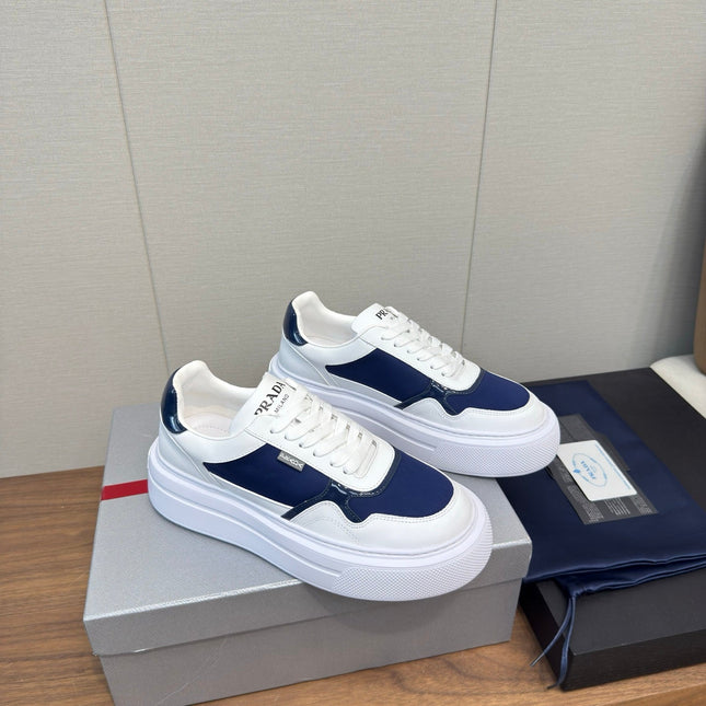 PRADA 25S DOWNTOWN BOLD SNEAKERS 45MM IN WHITE AND NAVY BLUE CALFSKIN