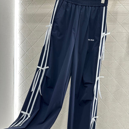 MIUMIU HIGH-WAISTED WIDE-LEG PANTS WITH BOW 276652