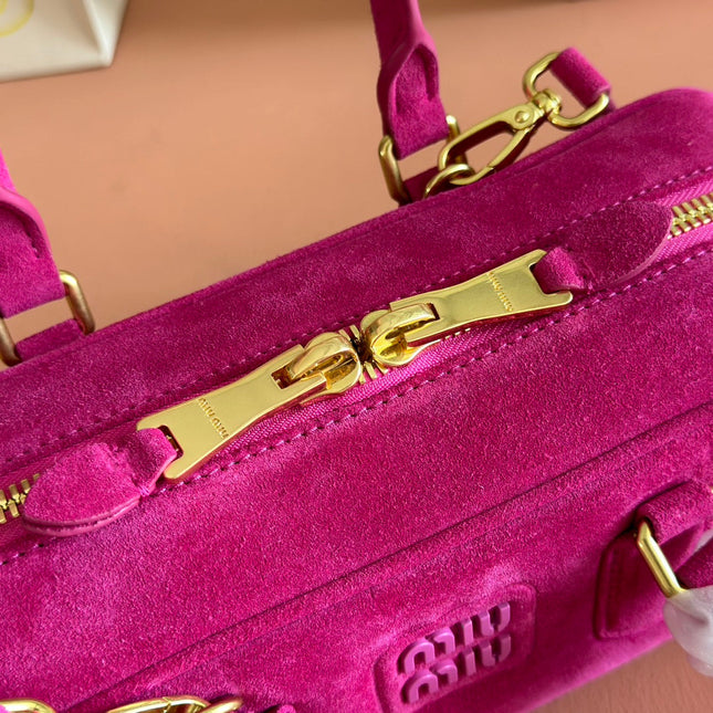 ARCADIE BAG 27 IN FUCHSIA SUEDE GOLD HARDWARE