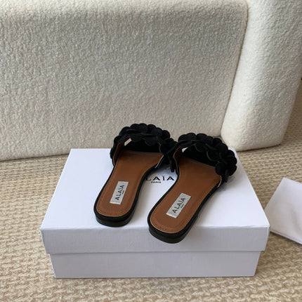 ALAIA FLAT MULE IN BLACK SUEDE