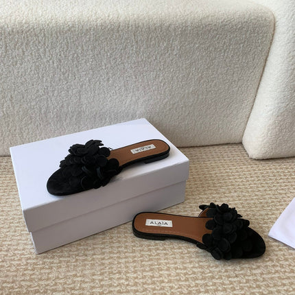 ALAIA FLAT MULE IN BLACK SUEDE