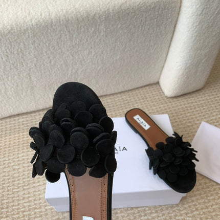 ALAIA FLAT MULE IN BLACK SUEDE