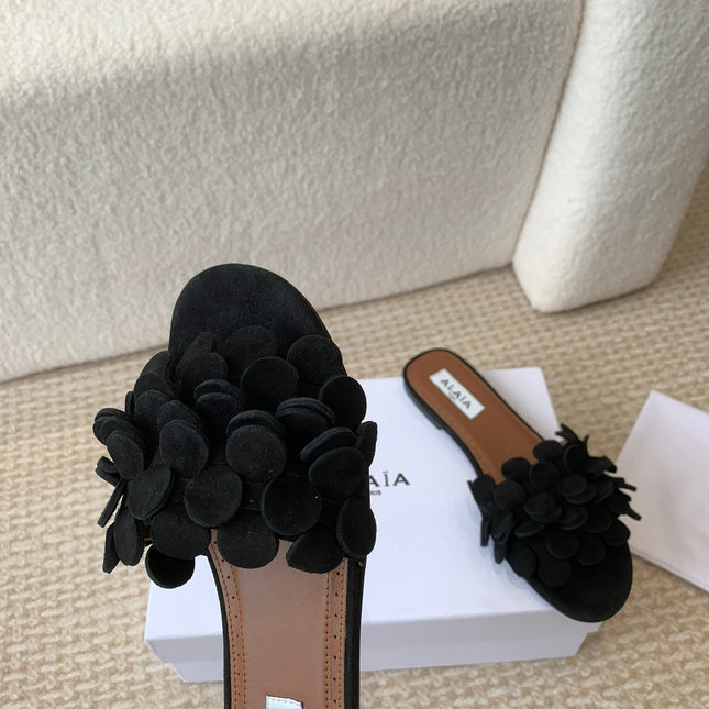 ALAIA FLAT MULE IN BLACK SUEDE