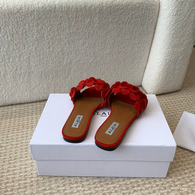 ALAIA FLAT MULE IN CHERRY RED SUEDE