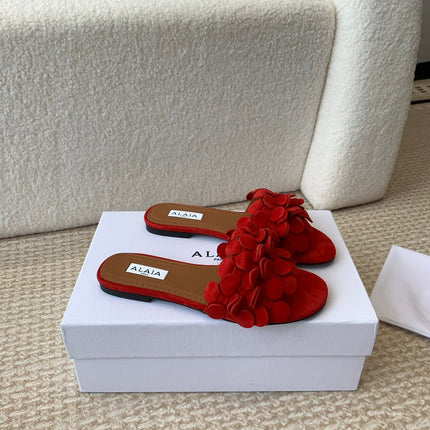 ALAIA FLAT MULE IN CHERRY RED SUEDE