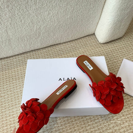 ALAIA FLAT MULE IN CHERRY RED SUEDE