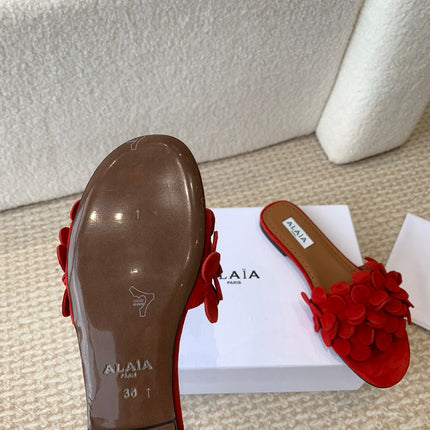 ALAIA FLAT MULE IN CHERRY RED SUEDE