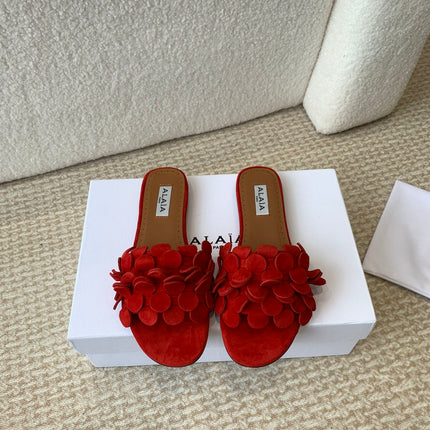 ALAIA FLAT MULE IN CHERRY RED SUEDE