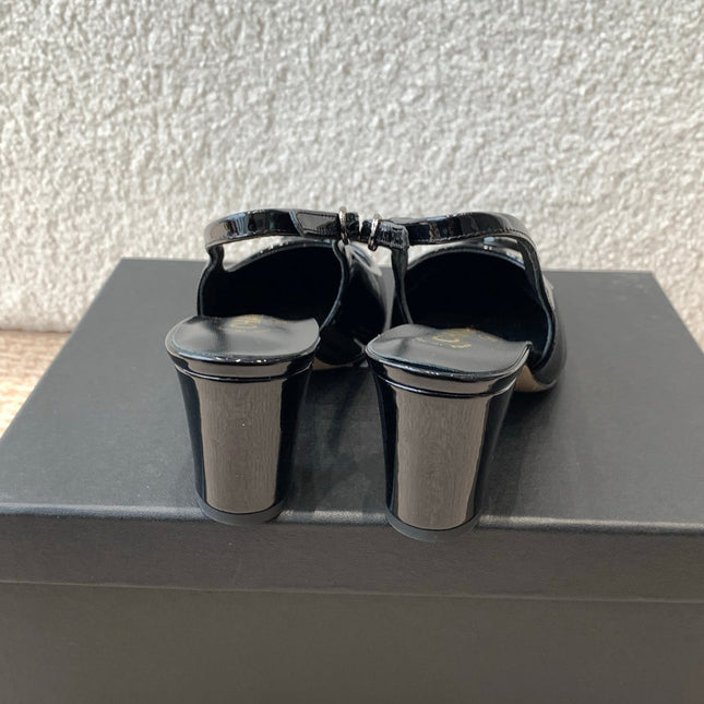 MID-HEEL SLINGBACKS IN BLACK PATENT CALFSKIN