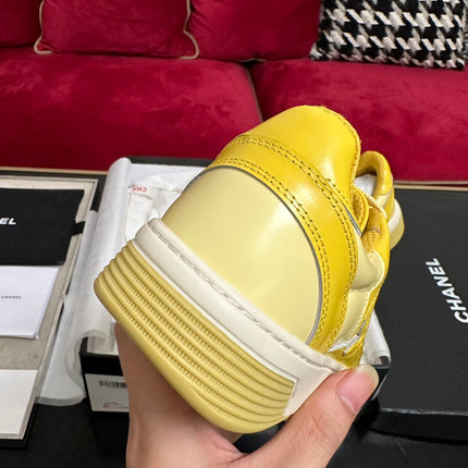 TRAINERS IN BRIGHT YELLOW SHINY CALFSKIN