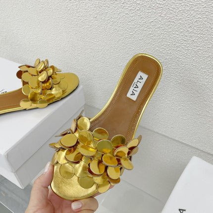 ALAIA FLAT MULE IN GOLDEN GLOSSY LAMBSKIN