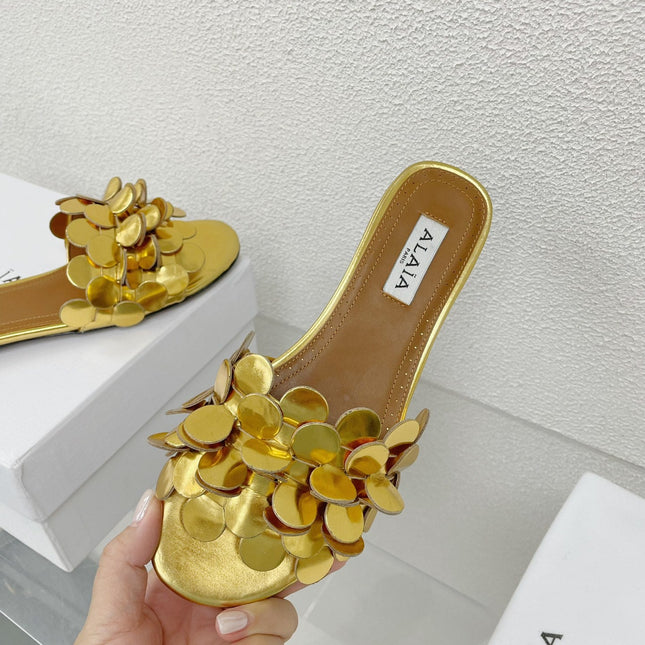 ALAIA FLAT MULE IN GOLDEN GLOSSY LAMBSKIN
