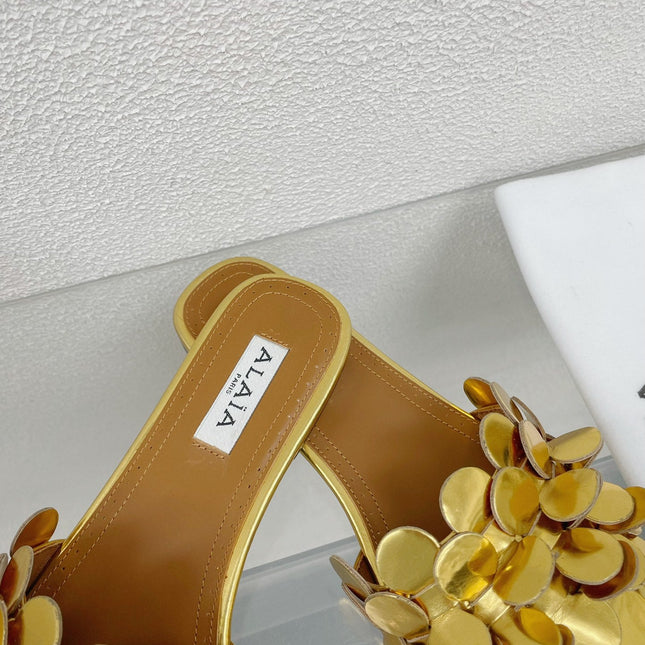 ALAIA FLAT MULE IN GOLDEN GLOSSY LAMBSKIN