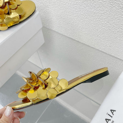 ALAIA FLAT MULE IN GOLDEN GLOSSY LAMBSKIN