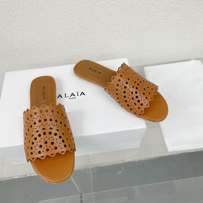 ALAIA VIENNE FLAT MULES IN CHOCOLATE BROWN LAMBSKIN