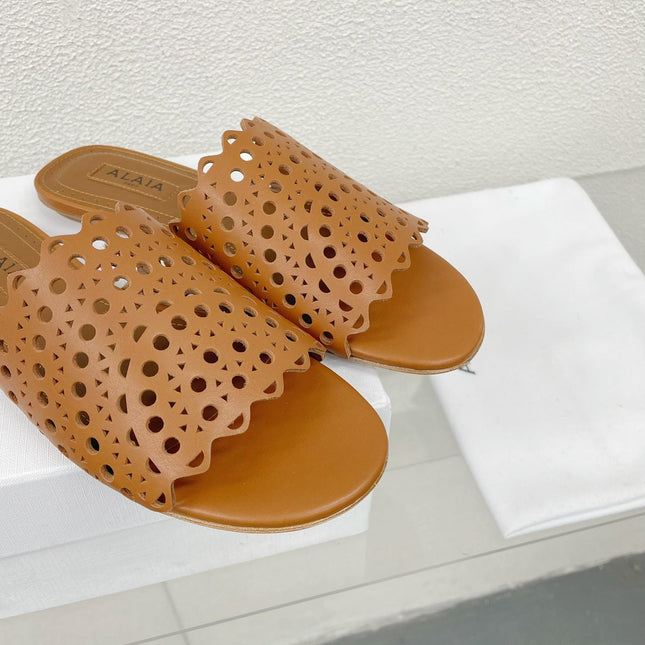 ALAIA VIENNE FLAT MULES IN CHOCOLATE BROWN LAMBSKIN
