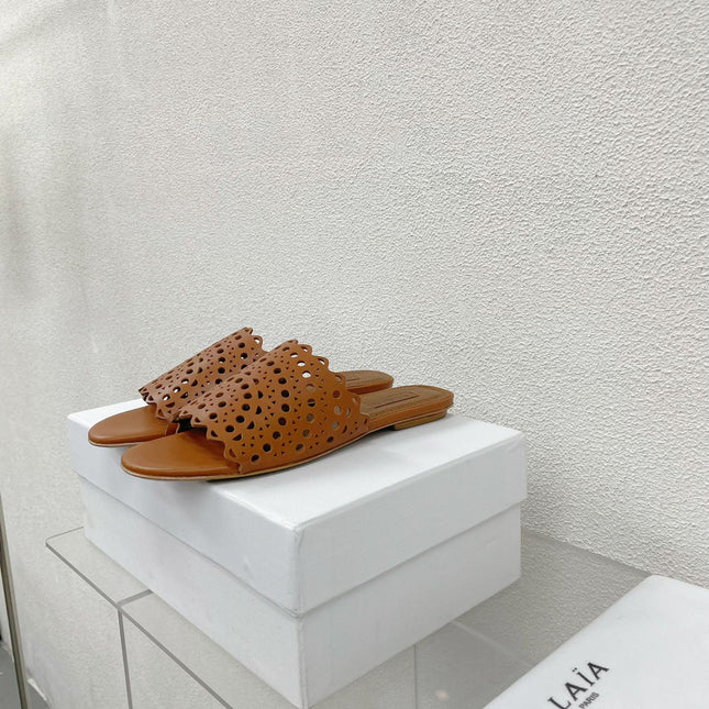 ALAIA VIENNE FLAT MULES IN CHOCOLATE BROWN LAMBSKIN
