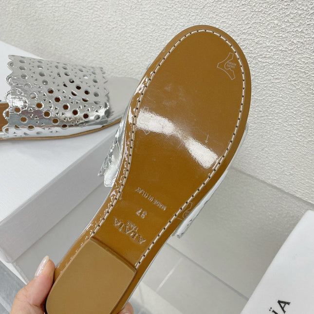ALAIA VIENNE FLAT MULES IN SILVER LAMBSKIN