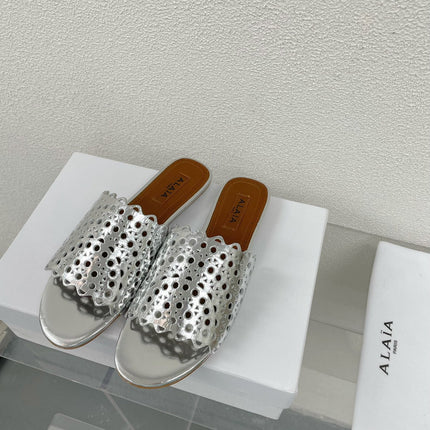 ALAIA VIENNE FLAT MULES IN SILVER LAMBSKIN