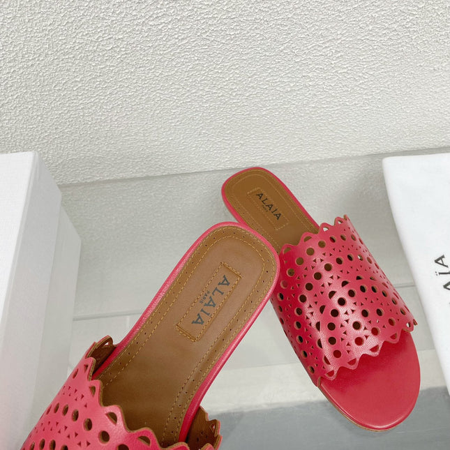 ALAIA VIENNE FLAT MULES IN CHERRY RED LAMBSKIN