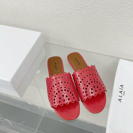 ALAIA VIENNE FLAT MULES IN CHERRY RED LAMBSKIN
