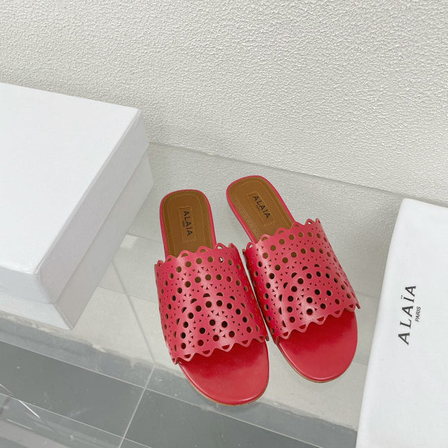 ALAIA VIENNE FLAT MULES IN CHERRY RED LAMBSKIN