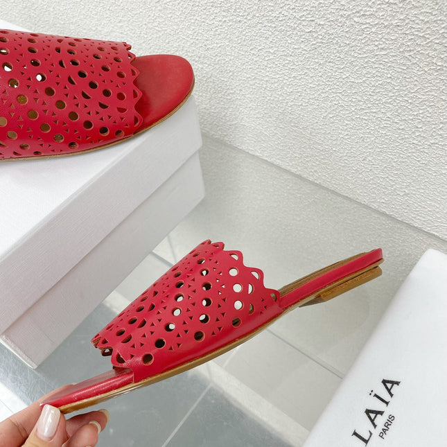 ALAIA VIENNE FLAT MULES IN CHERRY RED LAMBSKIN