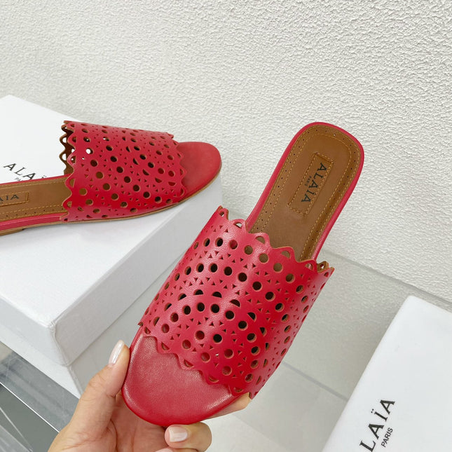 ALAIA VIENNE FLAT MULES IN CHERRY RED LAMBSKIN
