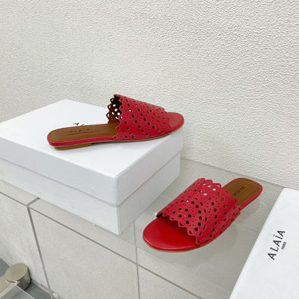 ALAIA VIENNE FLAT MULES IN CHERRY RED LAMBSKIN
