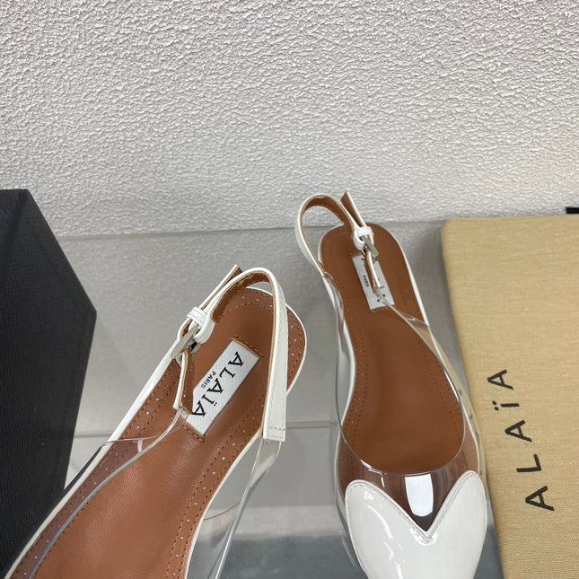 ALAIA LE COEUR FLAT SLINGBACKS IN WHITE PATENT LAMBSKIN