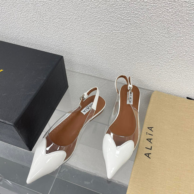 ALAIA LE COEUR FLAT SLINGBACKS IN WHITE PATENT LAMBSKIN