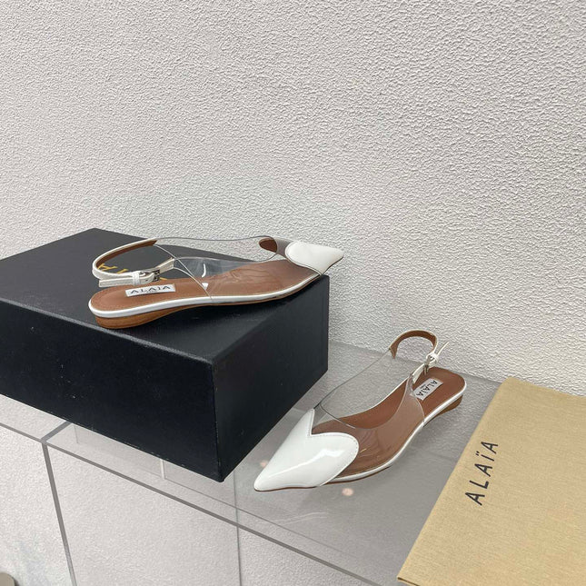 ALAIA LE COEUR FLAT SLINGBACKS IN WHITE PATENT LAMBSKIN