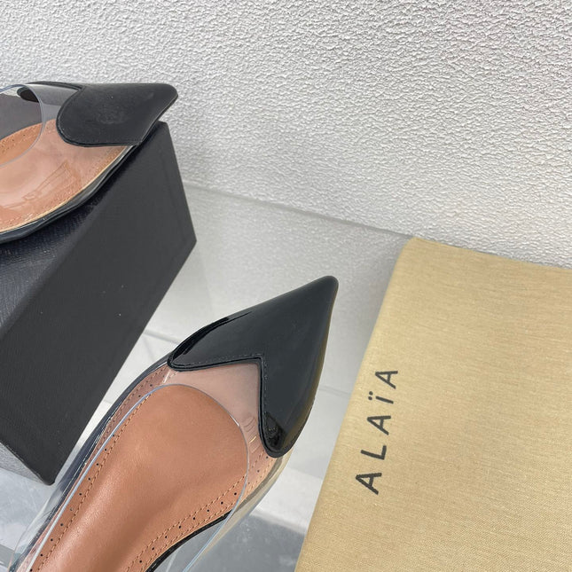 ALAIA LE COEUR FLAT SLINGBACKS IN BLACK PATENT LAMBSKIN
