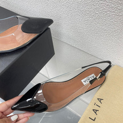 ALAIA LE COEUR FLAT SLINGBACKS IN BLACK PATENT LAMBSKIN