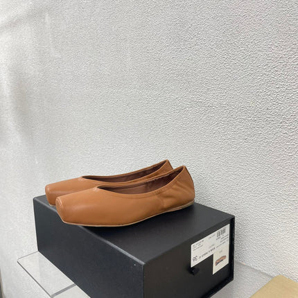 ALAIA BALLET FLATS IN COPPER BROWN CALFSKIN