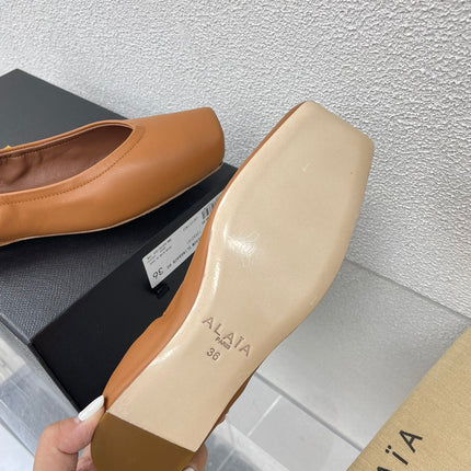 ALAIA BALLET FLATS IN COPPER BROWN CALFSKIN