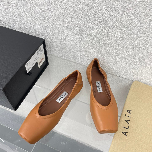 ALAIA BALLET FLATS IN COPPER BROWN CALFSKIN