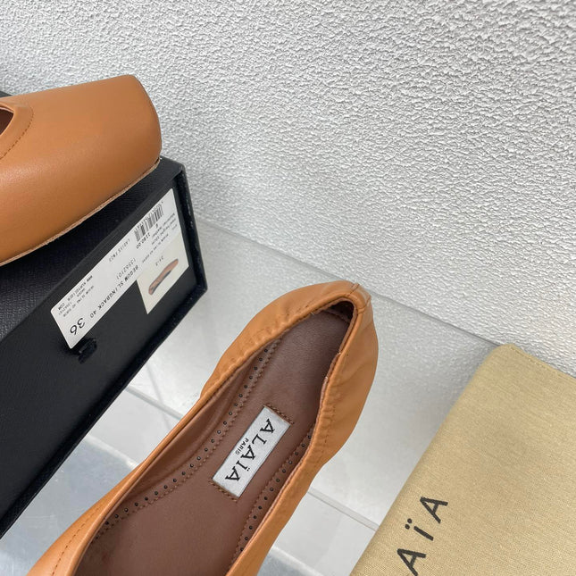 ALAIA BALLET FLATS IN COPPER BROWN CALFSKIN
