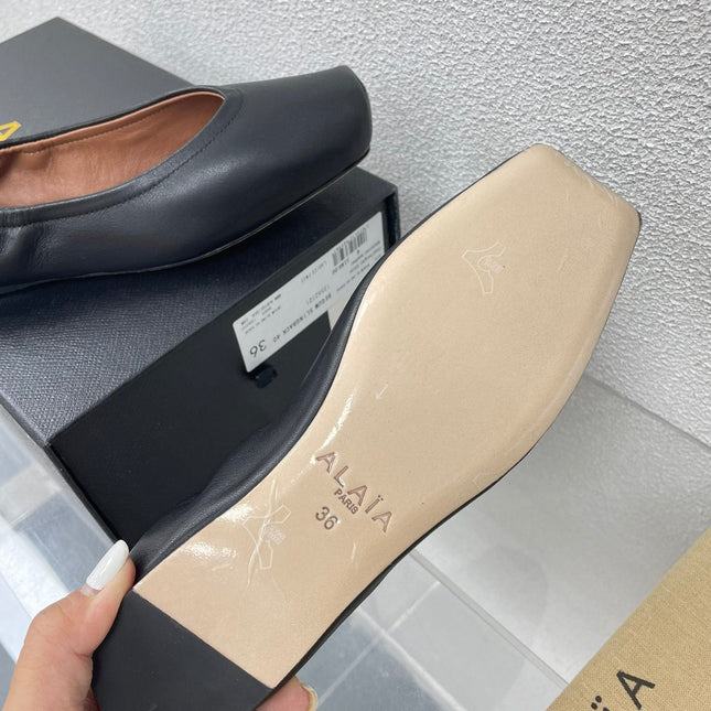 ALAIA BALLET FLATS IN BLACK CALFSKIN