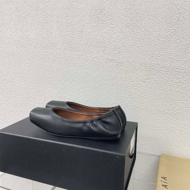 ALAIA BALLET FLATS IN BLACK CALFSKIN