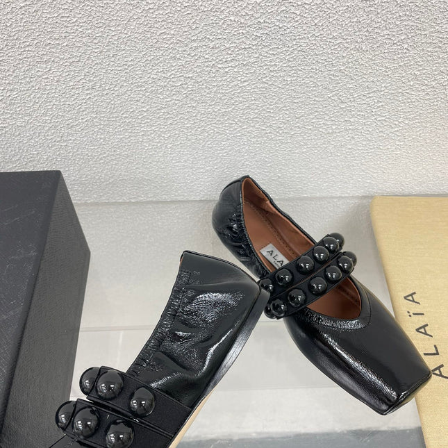 ALAIA MARY JANE PEARL IN GLOSSY BLACK LAMBSKIN
