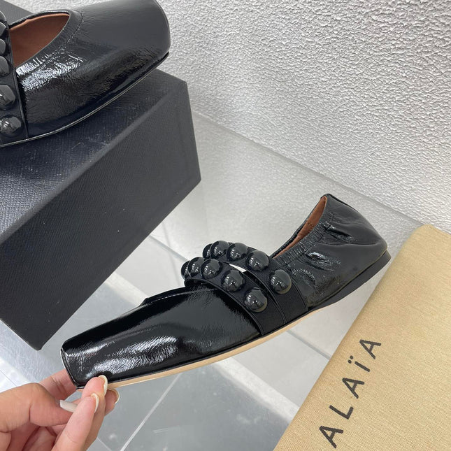 ALAIA MARY JANE PEARL IN GLOSSY BLACK LAMBSKIN